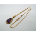 A 9ct gold, amethyst and pearl pendant on a 9ct gold paper link chain (44 cm length),