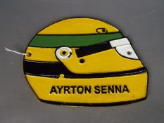 A cast Ayrton Senna sign approx 17 cm x 22 cm