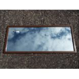 A vintage LMS wall or carriage mirror, the glass etched LMS and impressed to the frame,