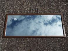 A vintage LMS wall or carriage mirror, the glass etched LMS and impressed to the frame,