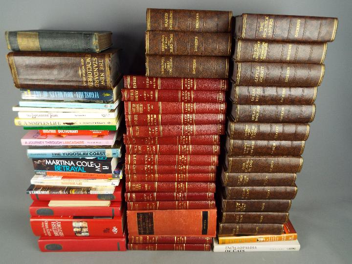 A large quantity of hardback books to include Dickens, educational and similar, three boxes.