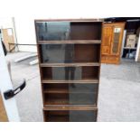 A bookcase with sliding glass doors,