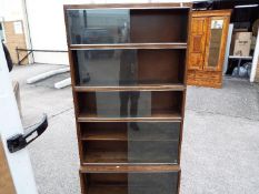 A bookcase with sliding glass doors,