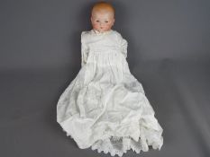 Armand Marseille bisque porcelain doll- Makers mark:AM Germany 341./4. Damaged open eyes.