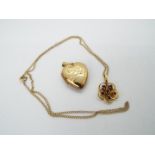 A 9ct gold stone set, flowerhead pendant on fine chain, approximately 2.