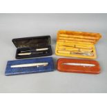 A small collection of pens including Sheaffer fountain with 14k nib,