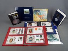 Philately - Two suede Benham binders containing a quantity of silk first day covers,