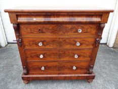 A substantial Victorian mahogany chest of four graduated drawers,