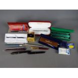 Pens - a quantity of pens to include a Cross ball point pen, Parker fountain pen with 14K gold nib,