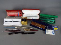 Pens - a quantity of pens to include a Cross ball point pen, Parker fountain pen with 14K gold nib,