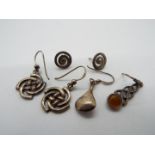 Two pairs of silver earrings plus 2 single silver earrings all marked 925, total weight approx 7.