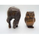 Two Japanese carved wood netsuke, one in the form of an owl, the other a grazing horse, both signed.