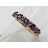 A 9 carat gold ring set with amethyst and diamonds,