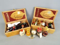A collection of various miniature / taster bottles of alcoholic drink to include whisky, brandy,