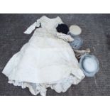 A vintage Laura Phillips wedding dress and a quantity of lady's hats contained in a hat box.
