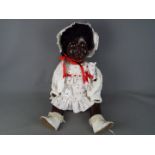 A large composition black girl doll with string jointed arms legs and head with sleeping brown eyes,