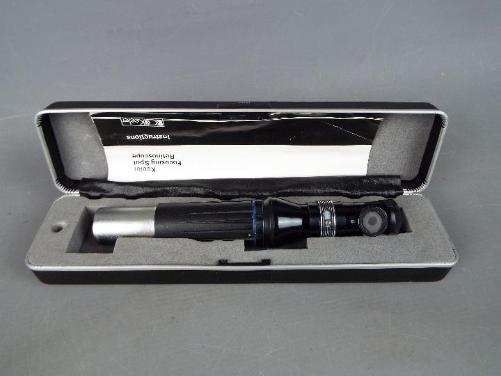 A cased Keeler Focusing Spot Retinoscope.