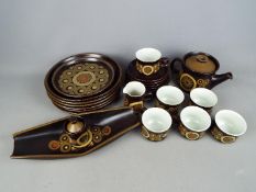 A quantity of Denby dinner and tea wares in the 'Arabesque' pattern, 26 pieces in total.