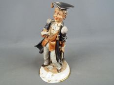 A good quality capodimonte figurine depicting a lawyer, signed,