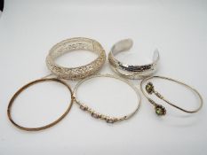 Silver Jewellery - four silver torque bangles (stamped) and one rolled gold bangle