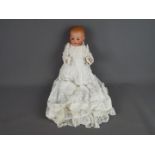 Armand Marseille German bisque porcelain doll- porcelain head and body.Moulded teeth.