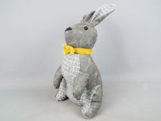 A fabric shelf rabbit,