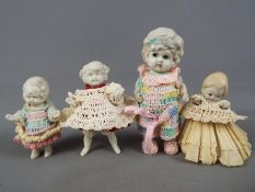 Penny Dolls - a collection of four Made in Japan bisque Penny Dolls ranging in size from 13 cm to 9