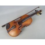 A violin and bow, the violin body 36 cm (length) Condition Report: Appears in good condition,