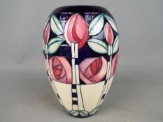 A Moorcroft Kingsborough vase signed E Bossoms,