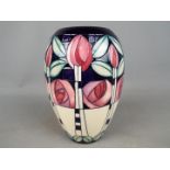 A Moorcroft Kingsborough vase signed E Bossoms,