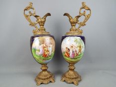 A large pair of decorative ewers, the body decorated with classical scenes, approximately 53 cm (h).