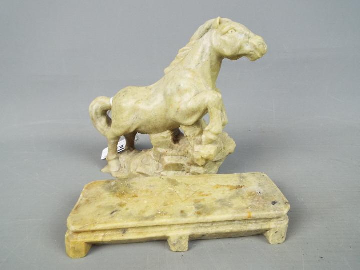 A stone carving depicting a horse, raised on plinth (approximately 16 cm height) and one further. - Image 2 of 3