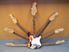 An interesting sculpture formed from a guitar and guitar parts to give the impression of a 7 necked