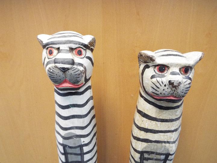 Two large painted wooden carvings depicting tigers, largest approximately 84 cm (h). - Image 2 of 2