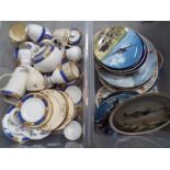 A quantity of dinner and tea wares comprising Royal Doulton 'Almond Willow',