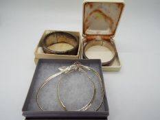 Two hallmarked silver bangles with safety chains and an Italian silver necklace (39 cm length) with