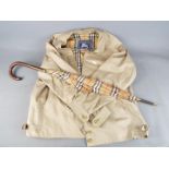 A gentleman's 'Harrington' jacket, marked 'Burberry's' size Regular-18 and a similar umbrella.