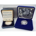 Two Silver Proof Coins - a silver crown (coin) issued to commemorate the marriage of Charles and