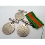 Three World War Two (WWII) medals and ribbon