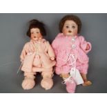 Armand Marseille - a pair of ceramic faced dolls consisting of a n Armand Marseille girl doll with