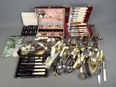 A quantity of plated and stainless flatware including cased sets and other.