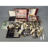 A quantity of plated and stainless flatware including cased sets and other.