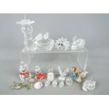 A collection of Swarovski and similar to include swans, candlestick, animals and other.