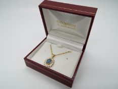 9 ct Gold - a 9ct gold fine twist rope necklace with a 9ct gold pendant set with Opal, stamped 375,