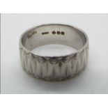 A platinum wedding band, size O, no fineness mark, hallmarked with orb in pentagon, London assay,