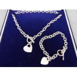 A boxed set of silver necklace and silver bracelet