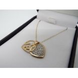 A heart shaped 18 necklace stamped 375, approx weight 1.