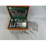 A canteen of Viners stainless steel cutlery with a quantity of similar loose pieces.