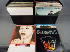 Two carry cases containing 12" vinyl records to include ABBA, Pink Floyd, New Order, Blondie,