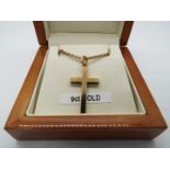 A hallmarked 9ct gold crucifix pendant on chain approximate length 60cm, stamped 375,